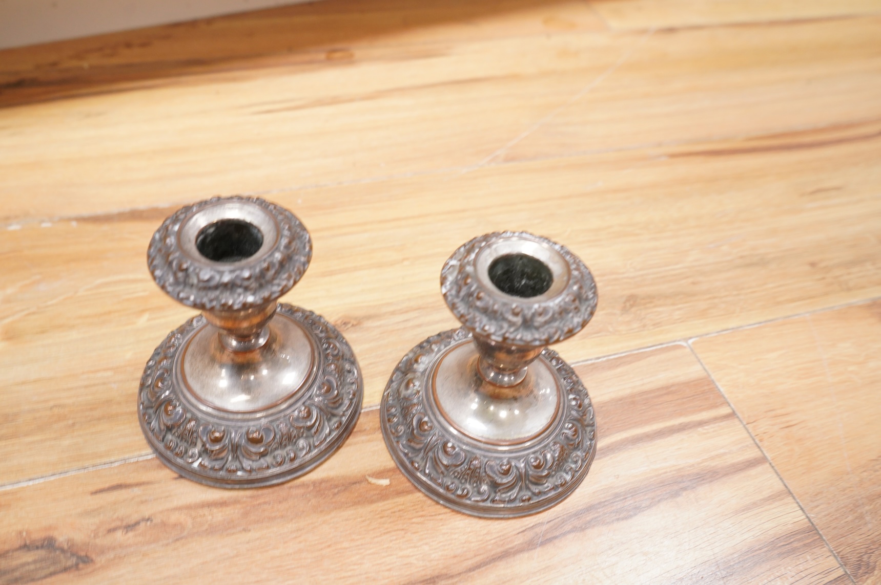 Assorted plated wares including pair of dwarf candlesticks, two pairs of entrée dishes, cased horn handled servers, set of flower holders, bread knife, mustard pot, salver, silver coins, two ceramic toby jugs, four pewte